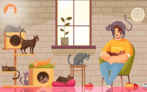 man happily surrounded by multiple cats